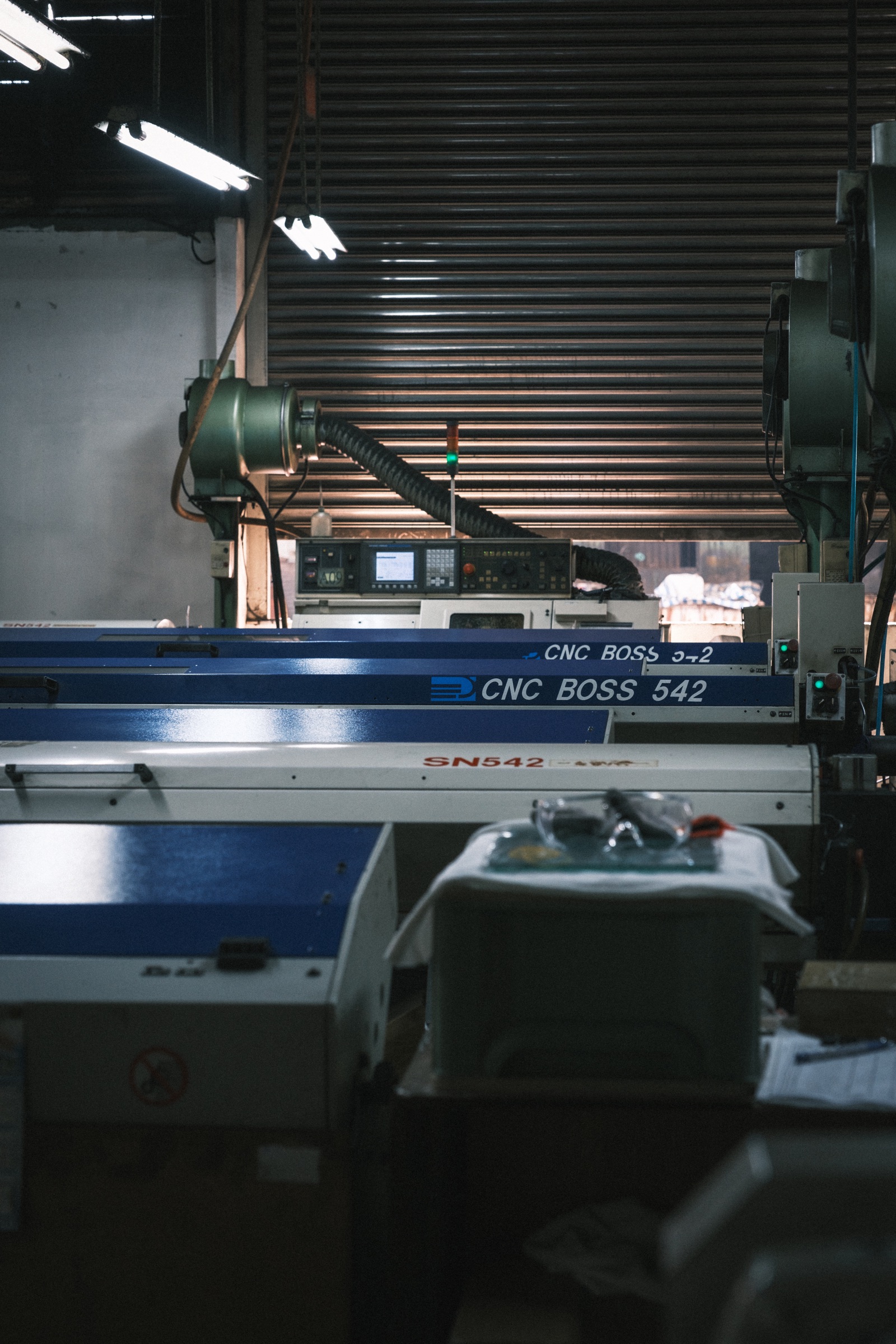 CNC machining center producing precision ball valve components with NPT and BSP threading